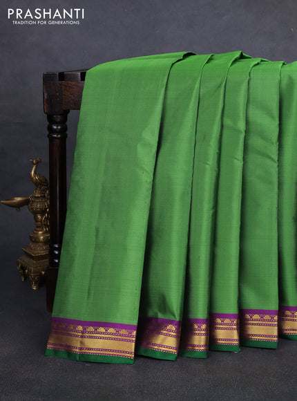 Pure kanchipuram silk saree light green and purple with plain body and temple zari woven border