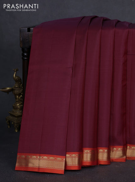 Pure kanchipuram silk saree maroon and orange with plain body and temple design zari woven border