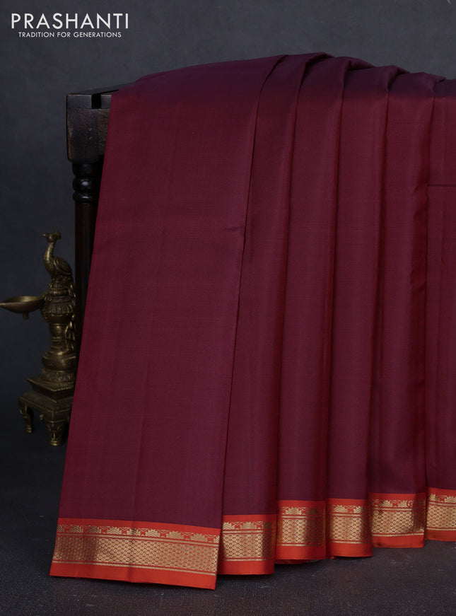 Pure kanchipuram silk saree maroon and orange with plain body and temple design zari woven border
