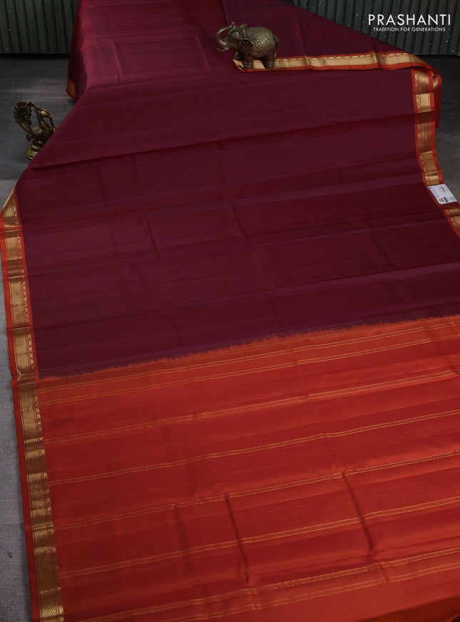Pure kanchipuram silk saree maroon and orange with plain body and temple design zari woven border