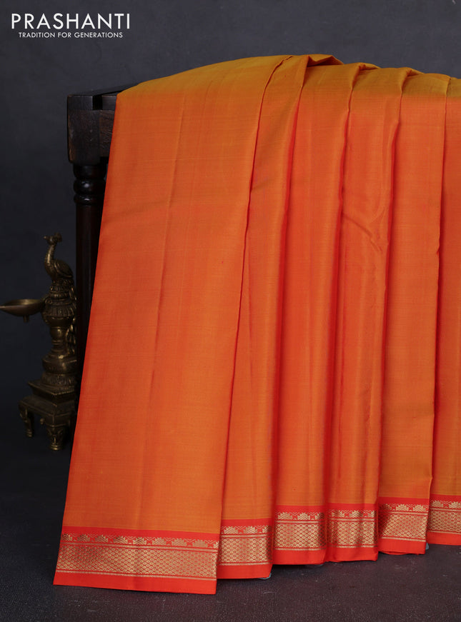 Pure kanchipuram silk saree sunset orange and orange with plain body and temple design zari woven border