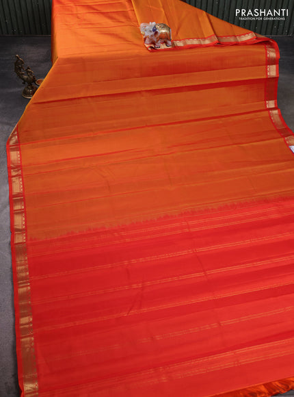 Pure kanchipuram silk saree sunset orange and orange with plain body and temple design zari woven border