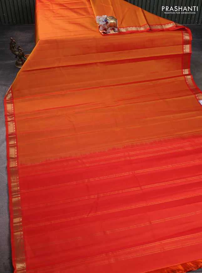 Pure kanchipuram silk saree sunset orange and orange with plain body and temple design zari woven border