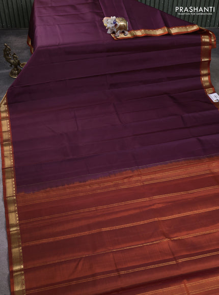 Pure kanchipuram silk saree deep wine and orange with plain body and temple design zari woven border