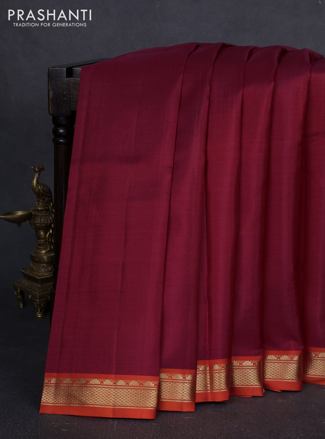 Pure kanchipuram silk saree maroon and orange with plain body and temple design zari woven border