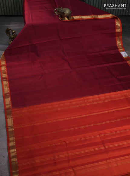 Pure kanchipuram silk saree maroon and orange with plain body and temple design zari woven border