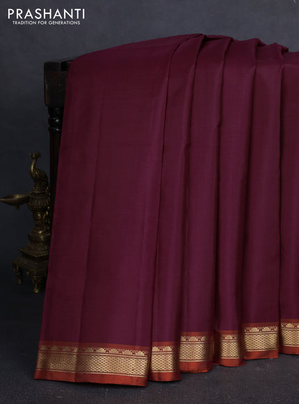 Pure kanchipuram silk saree deep wine shade and orange with plain body and temple design zari woven border