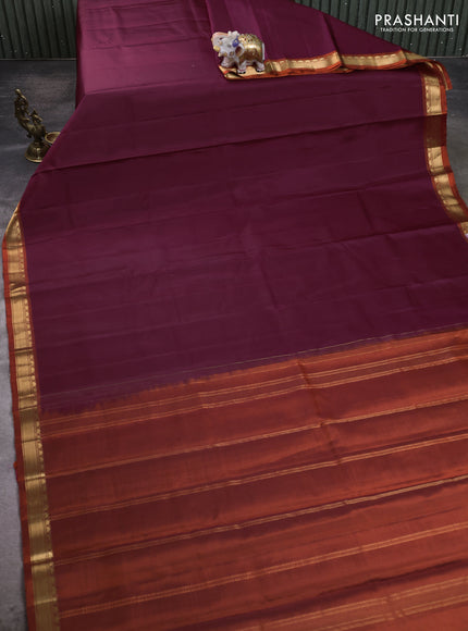 Pure kanchipuram silk saree deep wine shade and orange with plain body and temple design zari woven border