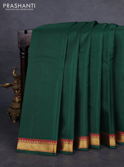 Pure kanchipuram silk saree bottle green and red with plain body and zari woven border