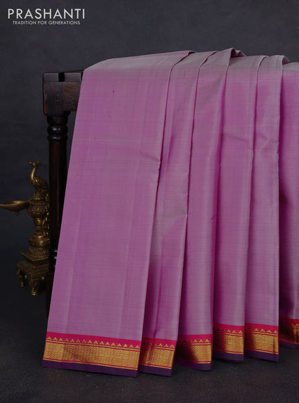 Pure kanchipuram silk saree pastel purple and purple with plain body and zari woven border