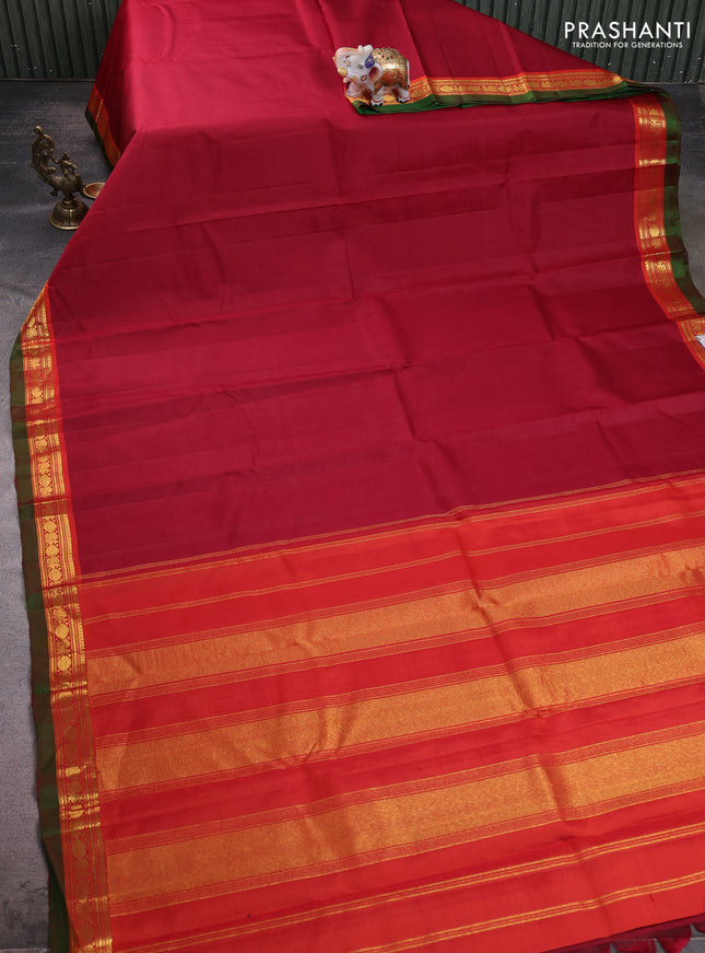 Pure kanchipuram silk saree maroon and red with plain body and zari woven border