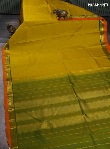 Pure kanchipuram silk saree yellow and orange with plain body and zari woven border