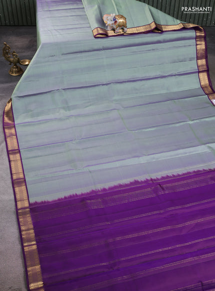 Pure kanchipuram silk saree pastel green and purple with plain body and zari woven korvai border