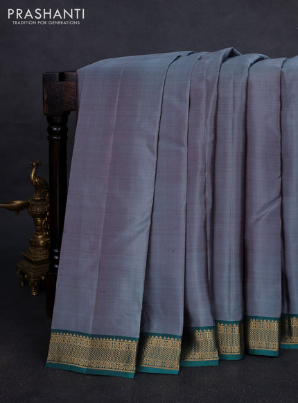 Pure kanchipuram silk saree grey and teal green with plain body and zari woven border