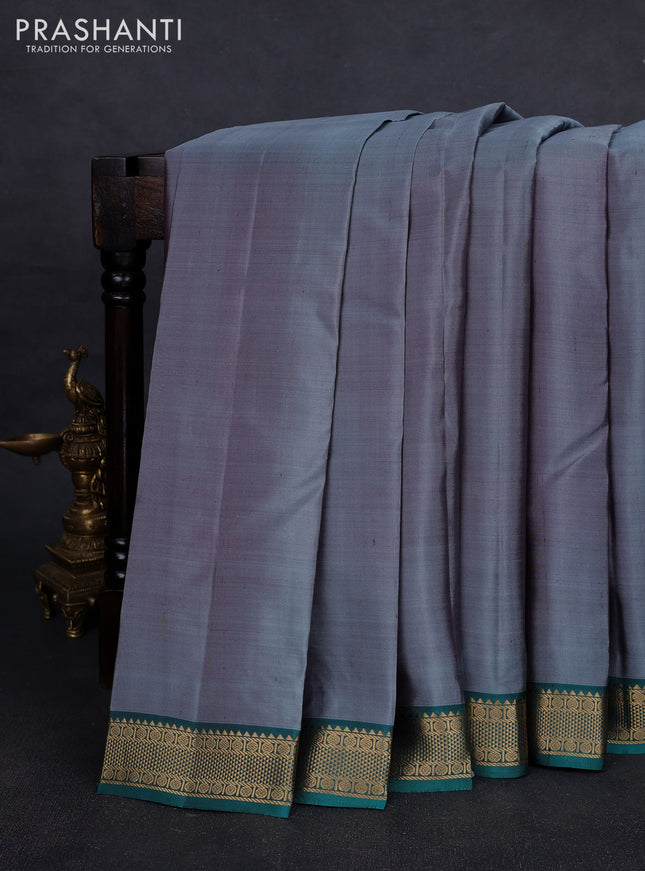 Pure kanchipuram silk saree grey and teal green with plain body and zari woven border