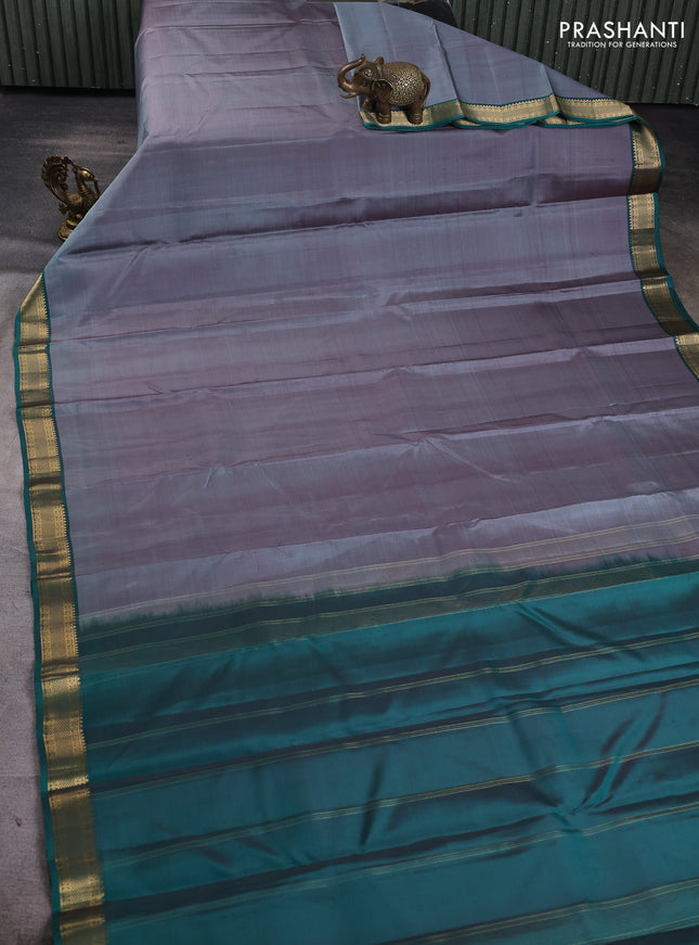Pure kanchipuram silk saree grey and teal green with plain body and zari woven border