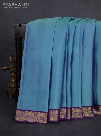 Pure kanchipuram silk saree blue shade and violet with plain body and zari woven border