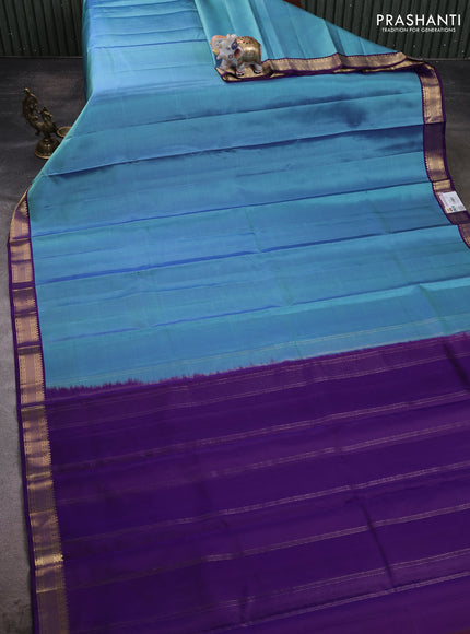 Pure kanchipuram silk saree blue shade and violet with plain body and zari woven border