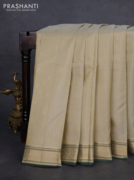 Pure kanchipuram silk saree pastel green and green with allover zari checks & buttas and zari woven border