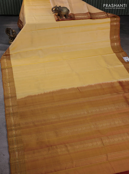 Pure kanchipuram silk saree pale yellow and mustard yellow with zari woven buttas and zari woven border