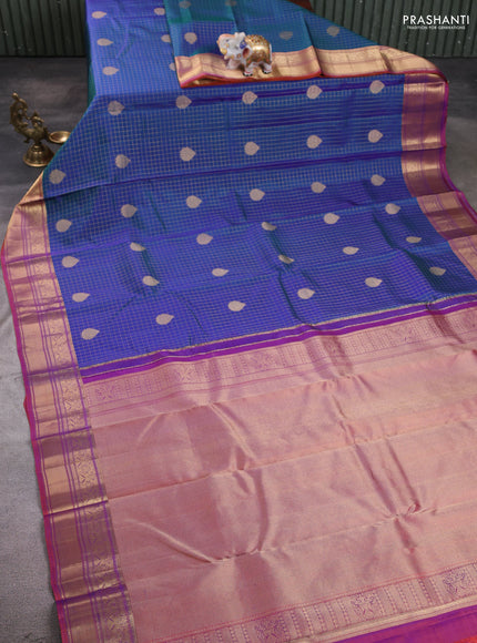 Pure kanchipuram silk saree dual shade of bluish green and purple with allover zari checks & buttas and zari woven border