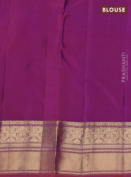 Pure kanchipuram silk saree dual shade of bluish green and purple with allover zari checks & buttas and zari woven border