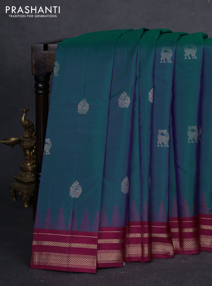Pure kanchipuram silk saree dual shade of bluish green and wine shade with zari woven buttas and temple design zari woven border