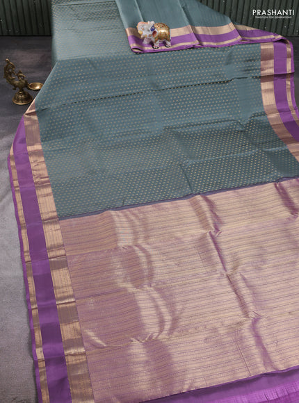 Pure kanchipuram silk saree greyish green and pastel purple with allover small zari checked pattern and rettapet zari woven border