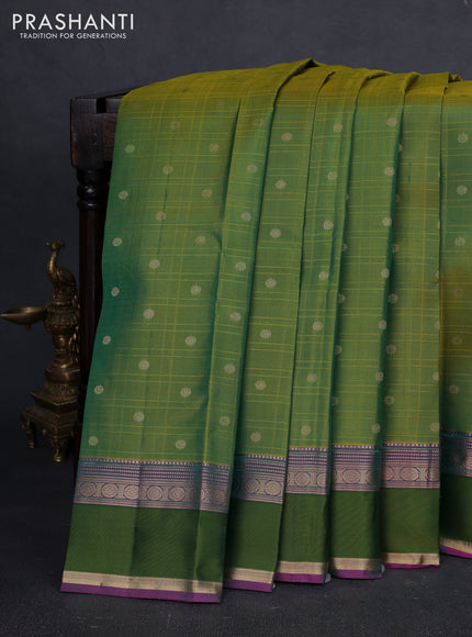 Pure kanchipuram silk saree dual shade og green and purple with allover checks & zari buttas and zari woven simple border