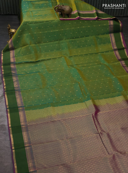 Pure kanchipuram silk saree dual shade og green and purple with allover checks & zari buttas and zari woven simple border