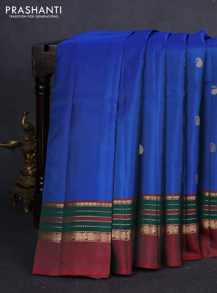 Pure kanchipuram silk saree cs blue and maroon with paisley zari woven buttas and zari woven simple border