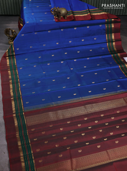 Pure kanchipuram silk saree cs blue and maroon with paisley zari woven buttas and zari woven simple border