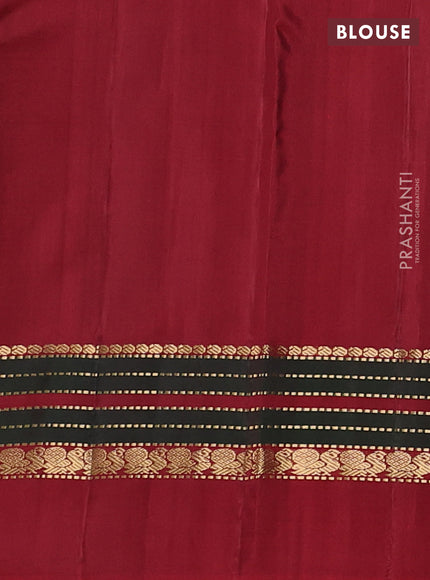 Pure kanchipuram silk saree deep wine and maroon with zari woven buttas and zari woven simple border