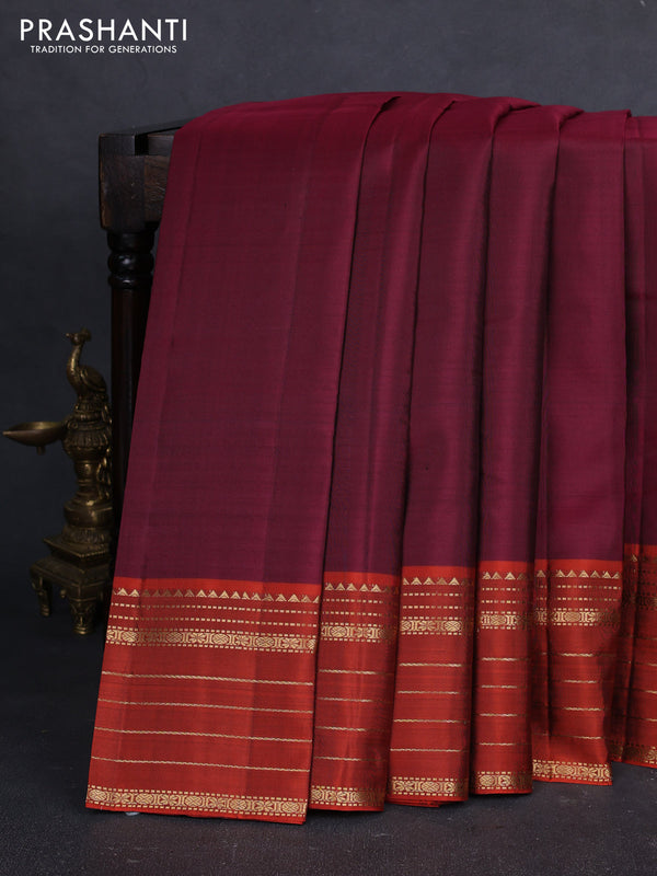 Pure kanchipuram silk saree wine shade and orange with plain body and zari woven border