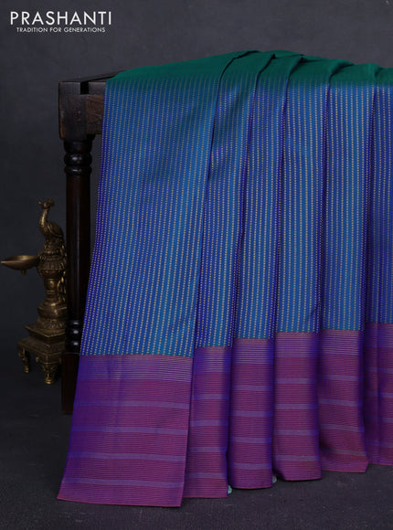 Pure kanchipuram silk saree dual shade of bluish green and purple with allover zari weaves and long zari woven border