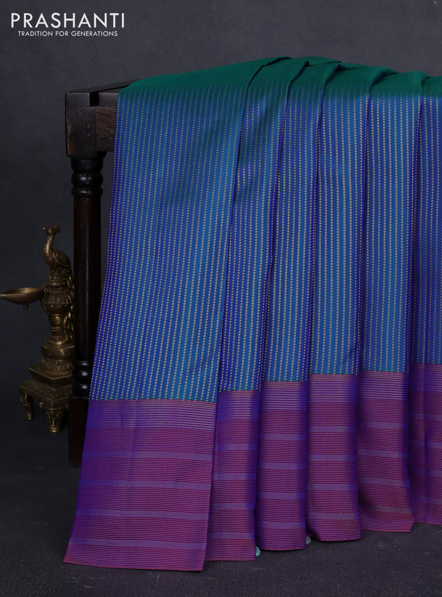 Pure kanchipuram silk saree dual shade of bluish green and purple with allover zari weaves and long zari woven border