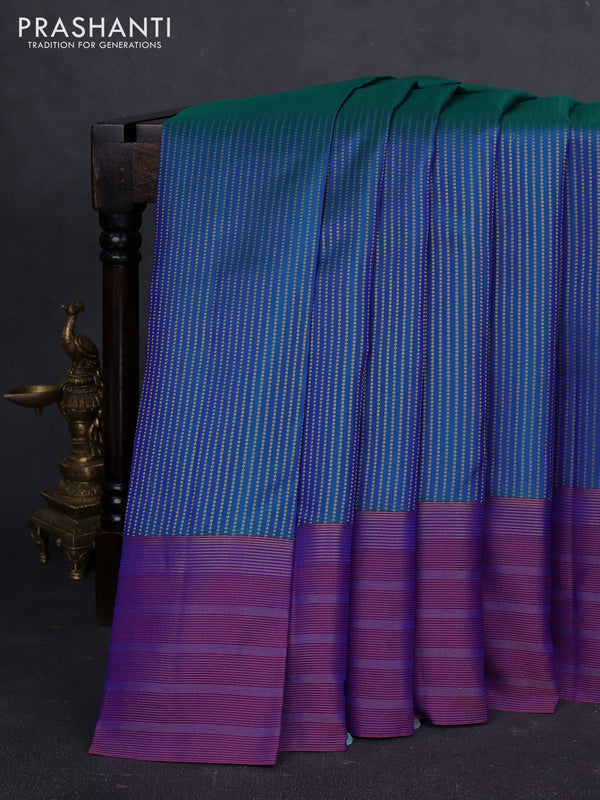 Pure kanchipuram silk saree dual shade of bluish green and purple with allover zari weaves and long zari woven border