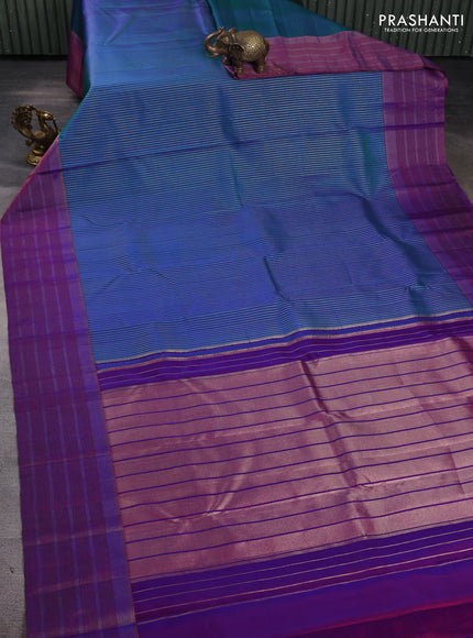 Pure kanchipuram silk saree dual shade of bluish green and purple with allover zari weaves and long zari woven border