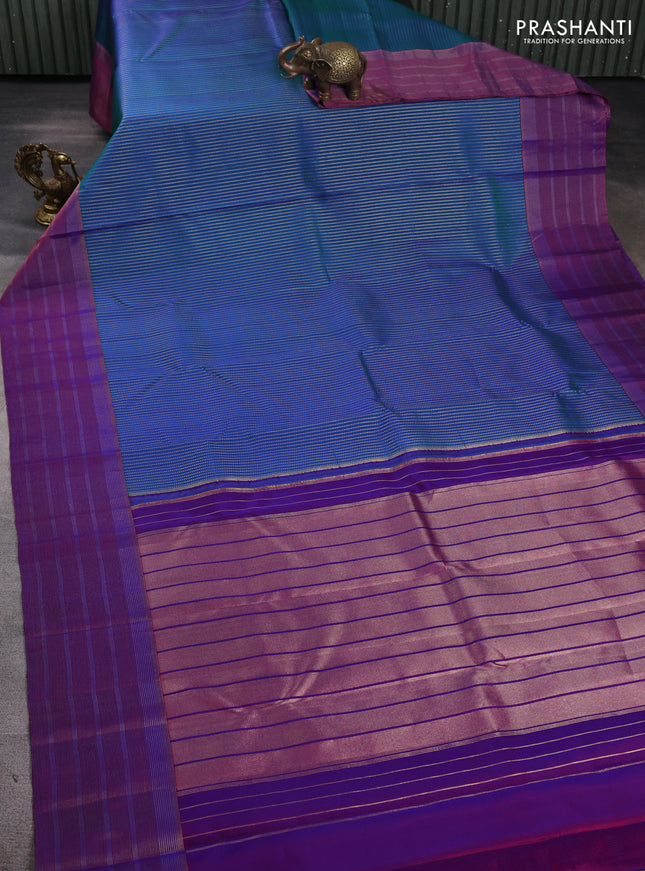 Pure kanchipuram silk saree dual shade of bluish green and purple with allover zari weaves and long zari woven border