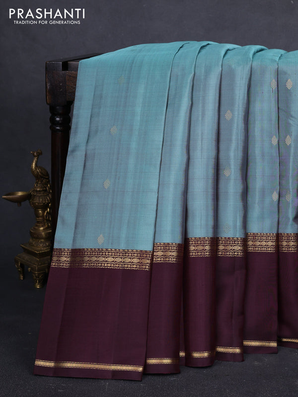 Pure kanchipuram silk saree pastel green and coffee brown with zari woven buttas and long rettapet zari woven border