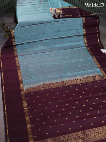 Pure kanchipuram silk saree pastel green and coffee brown with zari woven buttas and long rettapet zari woven border