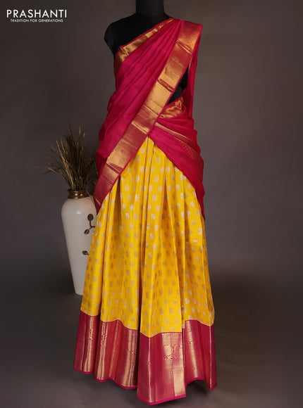 Pure kanchipuram silk lehenga dhawani yellow and pink with allover zari woven butta weaves and long rich zari woven border