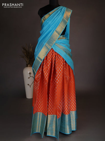 Pure kanchipuram silk lehenga dhawani orange and light blue with allover zari woven floral buttas and long zari woven border