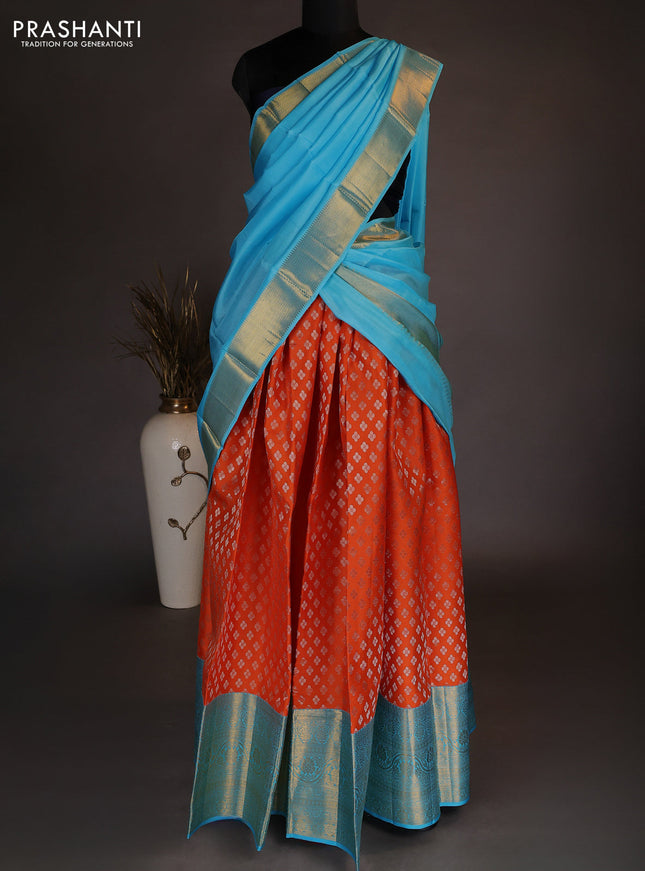 Pure kanchipuram silk lehenga dhawani orange and light blue with allover zari woven floral buttas and long zari woven border