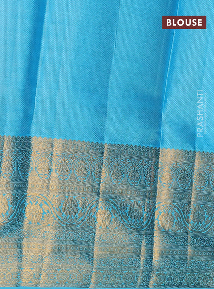 Pure kanchipuram silk lehenga dhawani orange and light blue with allover zari woven floral buttas and long zari woven border