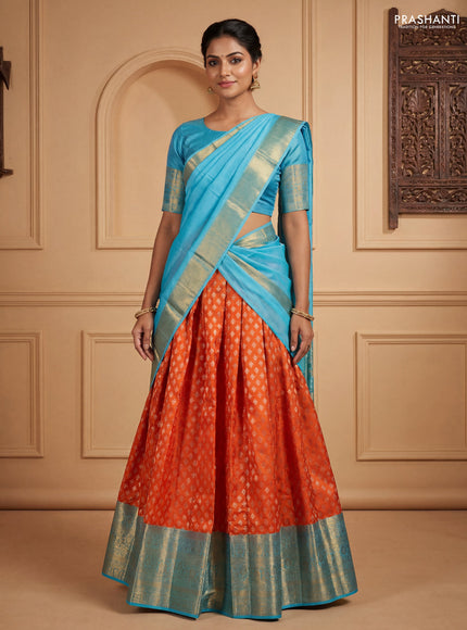 Pure kanchipuram silk lehenga dhawani orange and light blue with allover zari woven floral buttas and long zari woven border