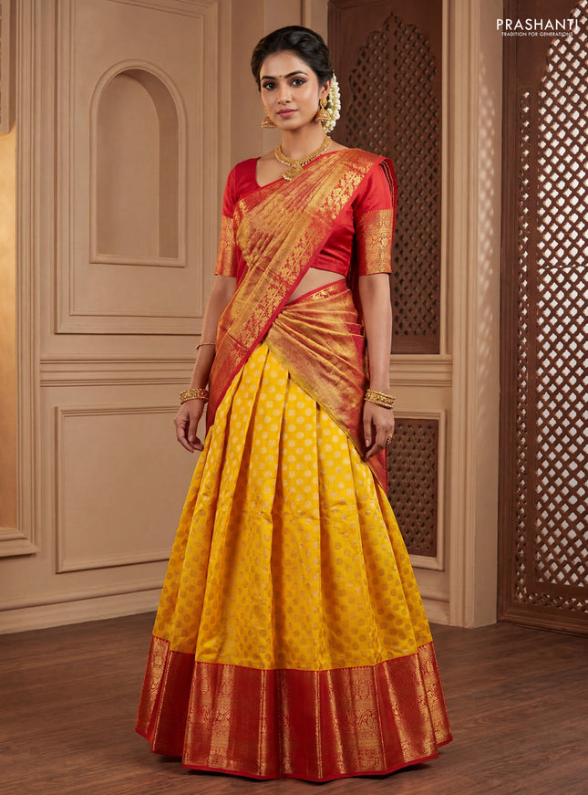 Pure kanchipuram silk lehenga dhawani yellow and red with allover zari woven floral buttas and long zari woven border