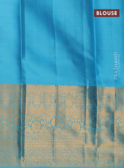 Pure kanchipuram silk lehenga dhawani orange and light blue with allover zari woven floral buttas and long zari woven border