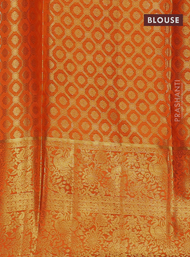 Pure kanchipuram tissue silk lehenga dhawani dual shade of rust and orange with allover zari woven brocade weaves and long rich zari woven border