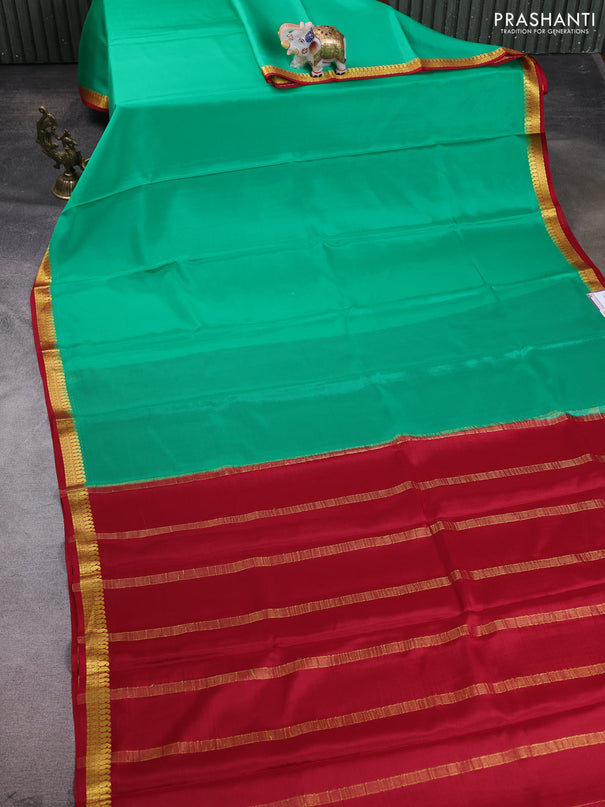 Pure mysore silk saree teal green and maroon with plain body and paisley zari woven border